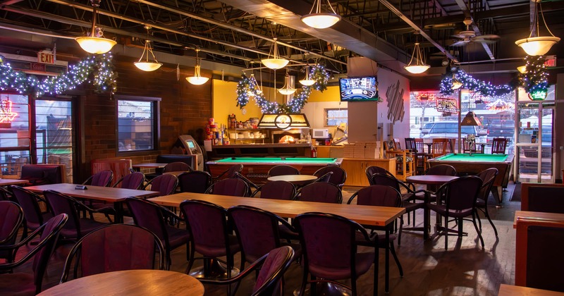 Intertior, seating area with pool tables behind