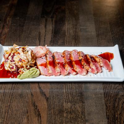 Tuna tataki with Asian-style slaw, pickled ginger, and wasabi.
