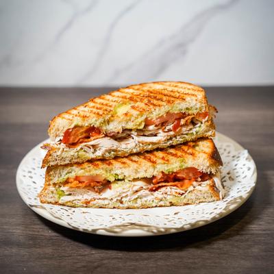 Grand Army Sandwich with turkey, bacon, avocado, and tomato on sourdough bread.