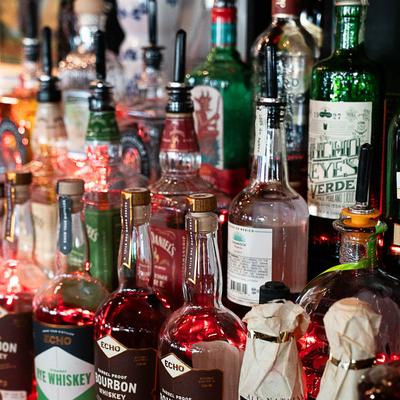 Liquor bottles arranged on a shelf.