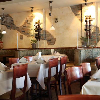 Interior, dining area, tables ready for guests.