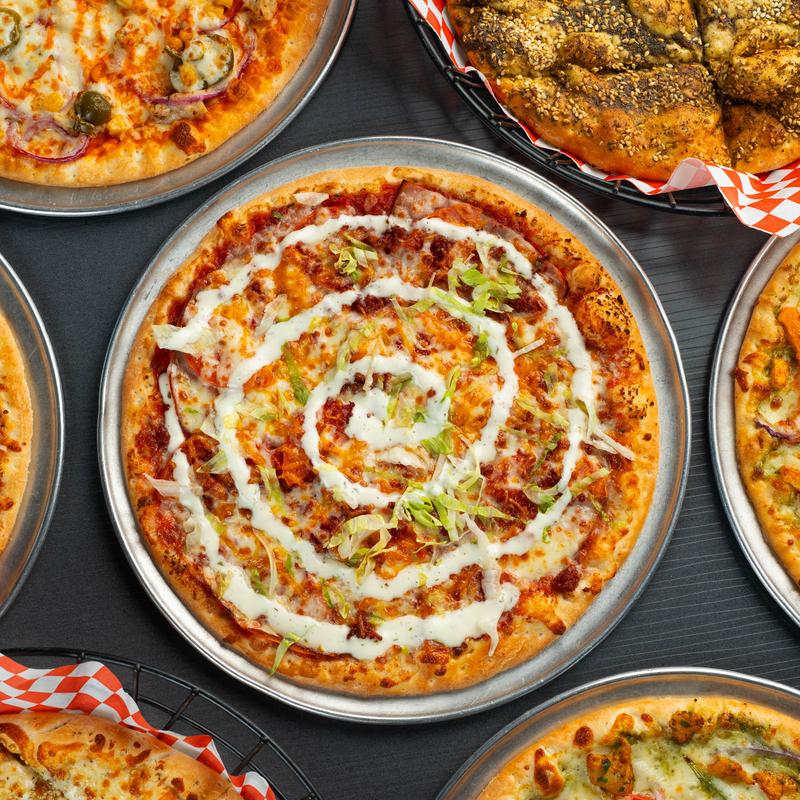 Assorted pizzas on the table.
