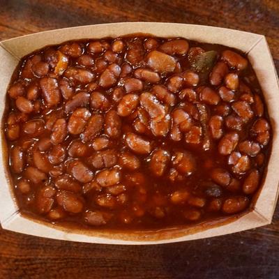 Baked beans in a takeout box