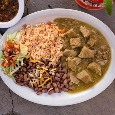 Lean pork stewed in tomatillo sauce, with tomato salsa, rice, and beans.