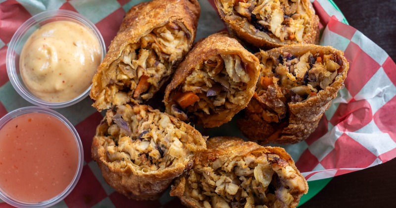 Roll With It Eggrolls served with ldipping sauces, overhead view