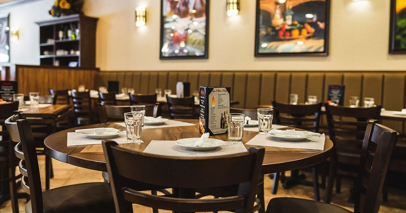 Interior, dining table with tableware and glasses close up