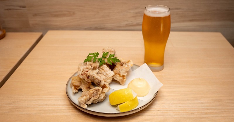 Japanese fried chicken served with a glass of beer