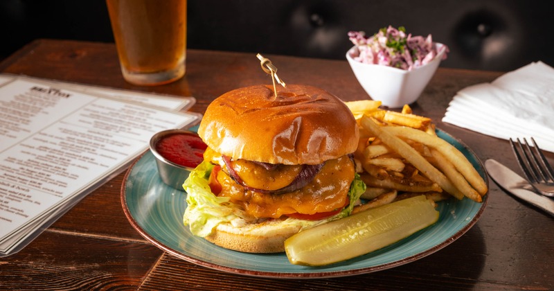 Double Cheeseburger served with fries, a pickle and a dip