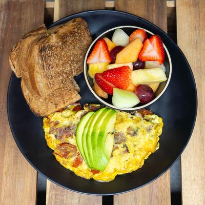 Bacon Avo Tomato Omelet, toast, fresh fruit salad.