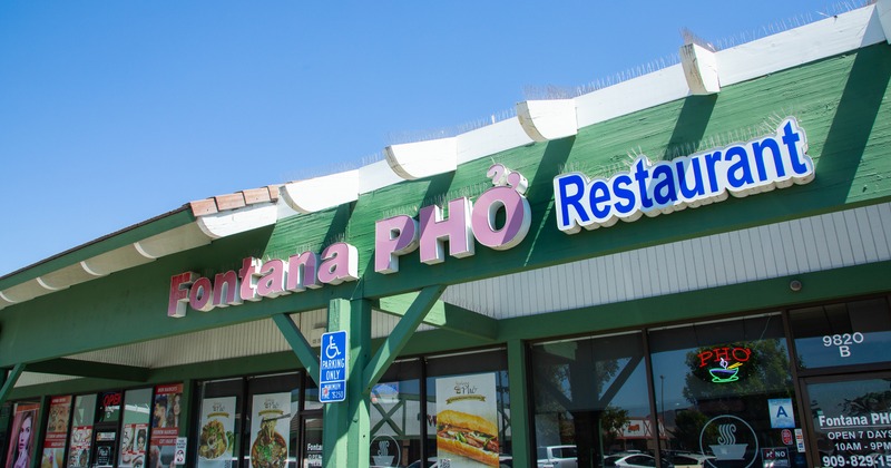 Exterior, angle view to restaurant, sign above entrance