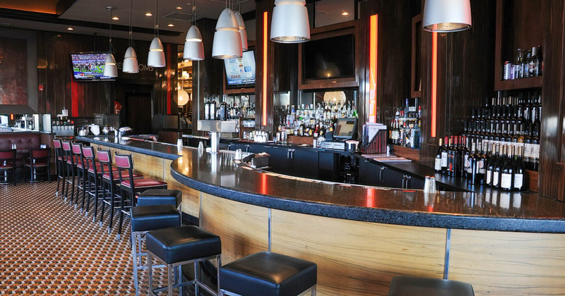 Interior, bar area with tall chairs lined up