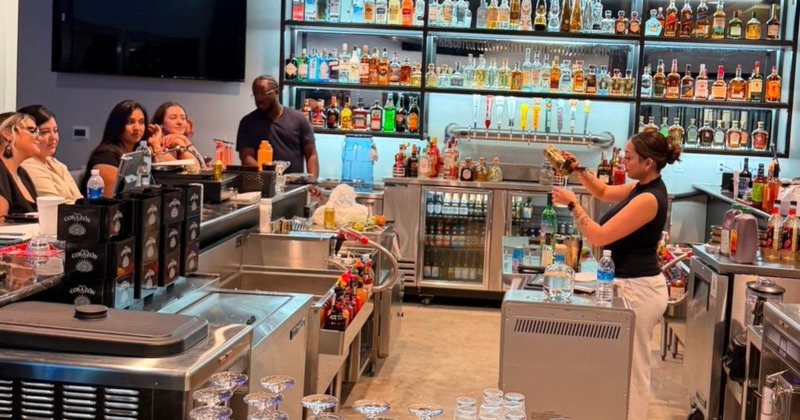 View at the bar with people seating at it