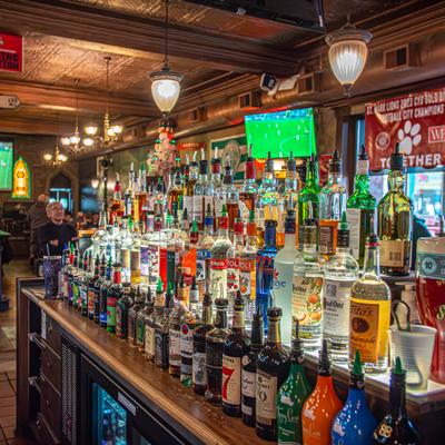 Pub's interior with a fully stocked bar.