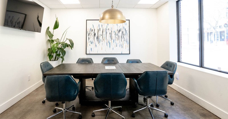 Interior, meeting room, leather seating, big TV on the wall