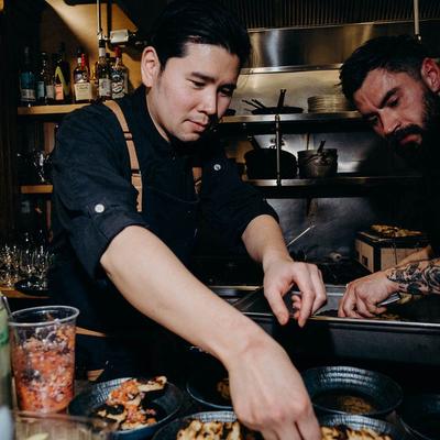 Chef garnishing dishes.