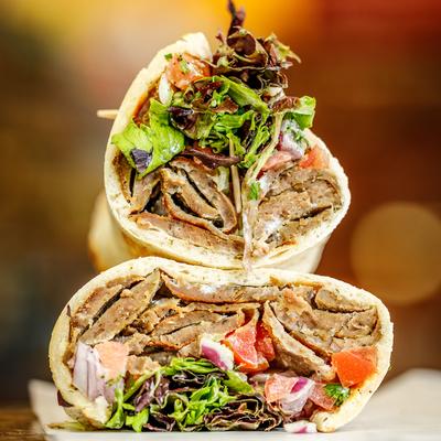 Gyro wrap cut in half, close-up.