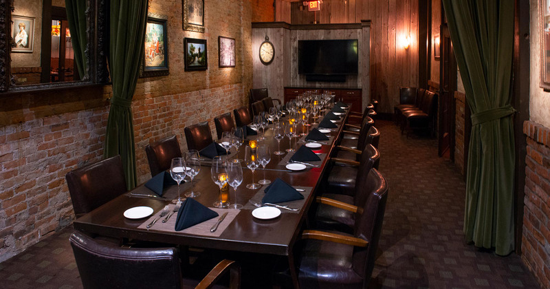Long table with comfortable chairs, ready for guests
