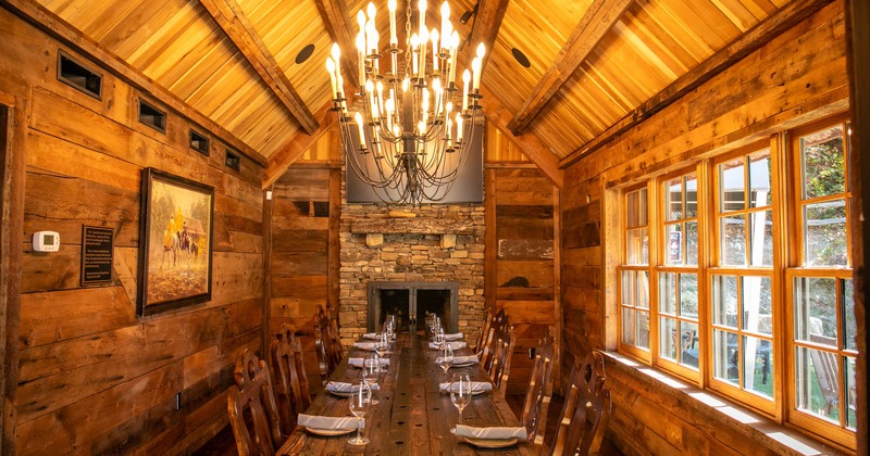 Interior, large wooden table with ten chairs