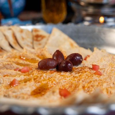 Classic Hummus with olives and pita bread.