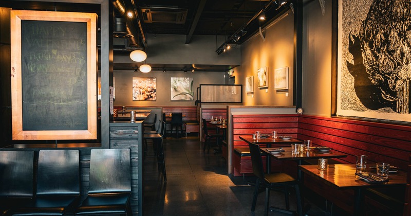 Interior, wooden sitting booths and set tables