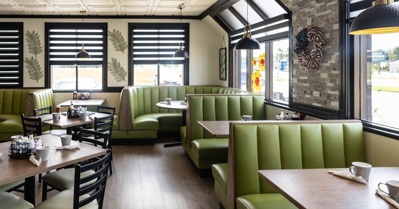Interior, seating area with booths, tables and chairs