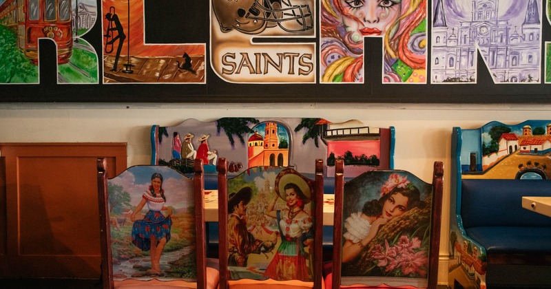 Chairs with paintings on the back