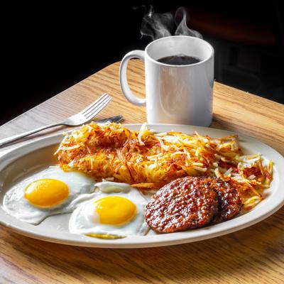 Two eggs with smoked sausage.