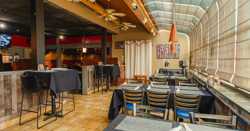 Inside, seating area with tables and chairs