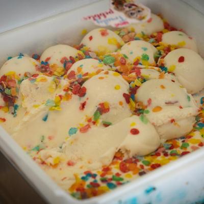 Vanilla ice cream dessert with colorful cereal topping.