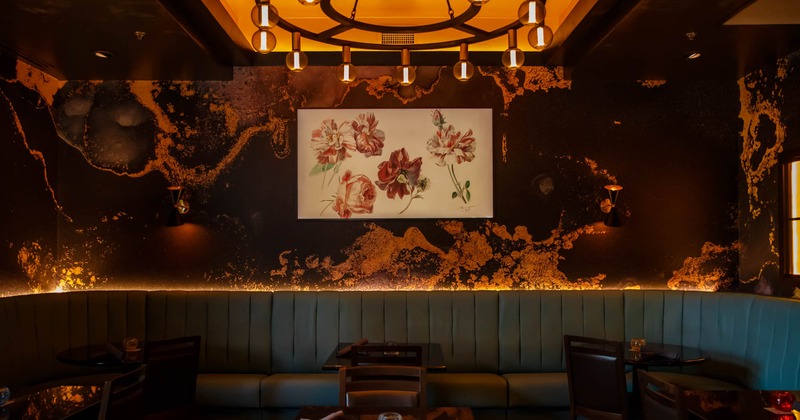 Interior, banquette seating area, big picture on the wall