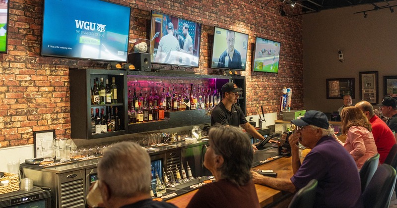 Bar, guests, tv screens