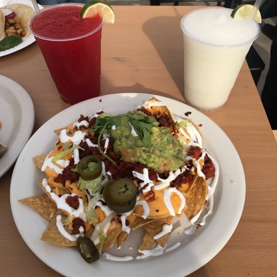 Snacks with dip and vegetables on the side.