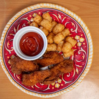 Chicken tenders, with dip and side, top view.