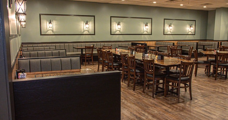 Interior, dining area, long table setup for fourteen people, seating booths, banquette seating