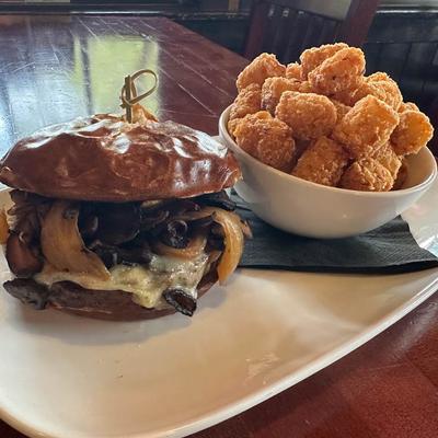 Mushroom cheeseburger, with a side of tater tots.