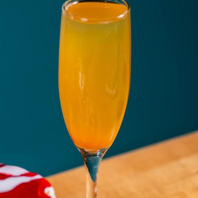 Mimosa in a flute glass, close up.