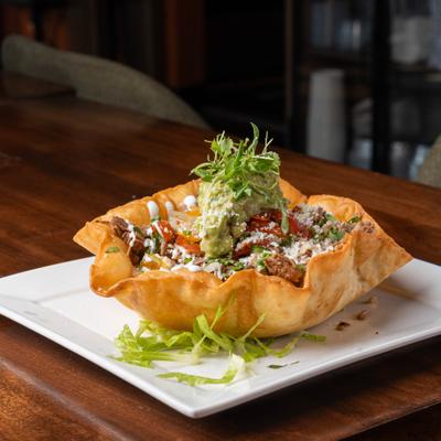 Taco salad in a crispy tortilla bowl.