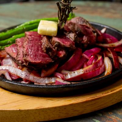 Steak fajitas with side of asparagus.