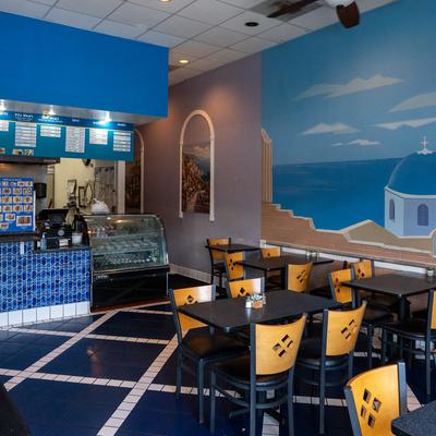 Interior, diner area, tables, chairs, food counter.