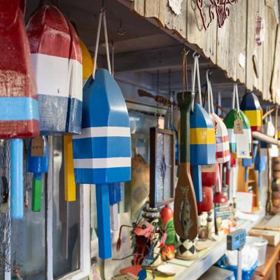 Colorful wooden lobster buoys often used as nautical decoration.