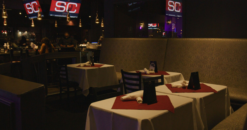 Corner booth in dining area, dimmed lights