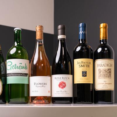 Assorted wine bottles arranged on a counter.
