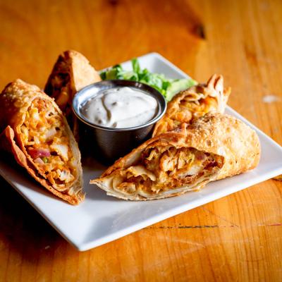 Egg rolls with dipping sauce.
