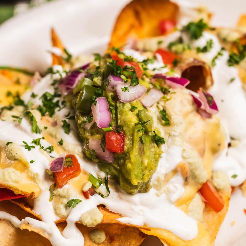 Cheese Nachos with Melted Cheddar, Pico de Gallo & Guacamole photo
