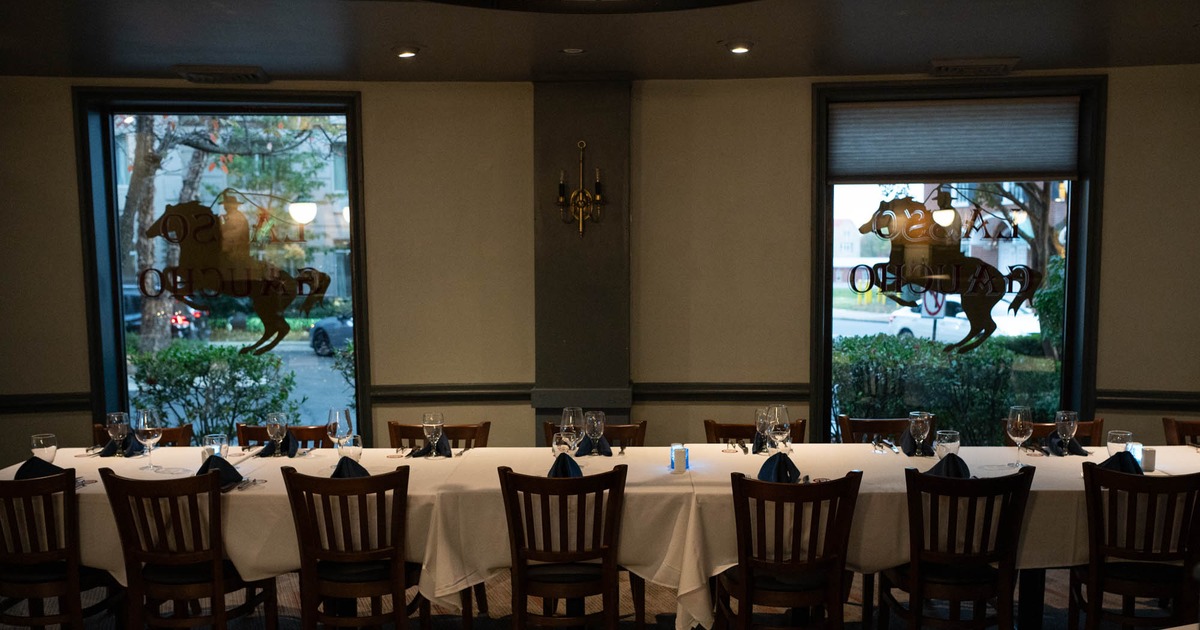 Interior, long table ready for guests