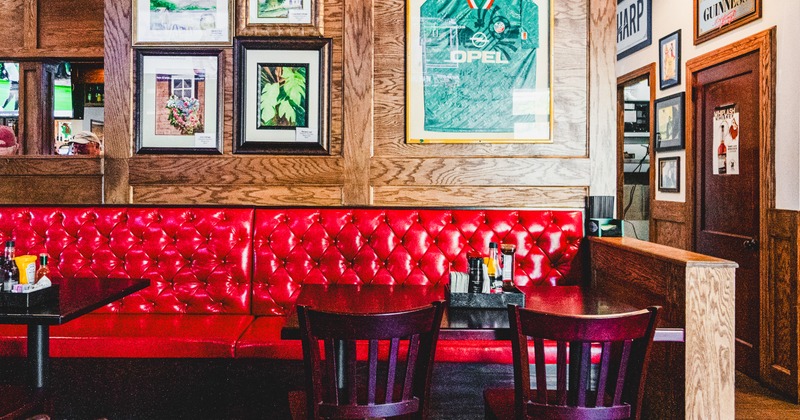 Intrior, booths in a corner, tables and chairs