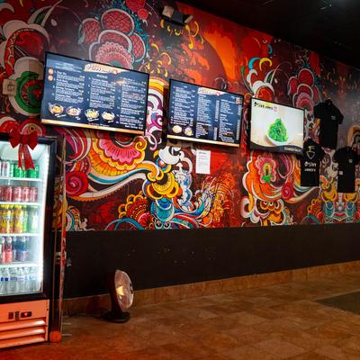 Flat screen menus on the wall.