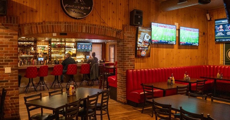 Interior dining and seating area, TVs on the wall