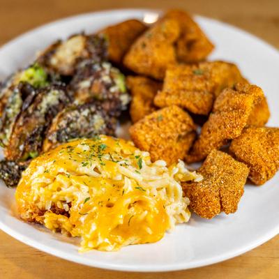 Fried catfish bites, with mashed potatoes and gravy, and brussels sprouts.