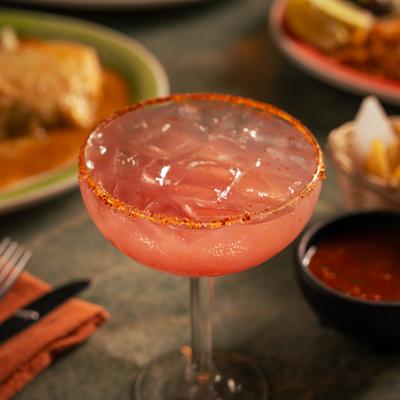 Strawberry Margarita served in chili-rimmed coupe glass.